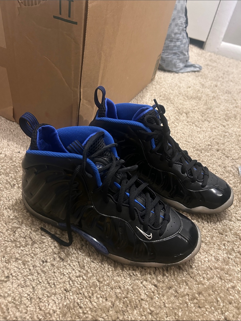 Nike Black Foamposite Sneakers with Blue Lining